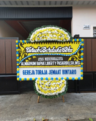 Papan Bunga Duka di Olo