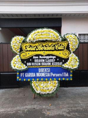 Papan Bunga Duka di Olo